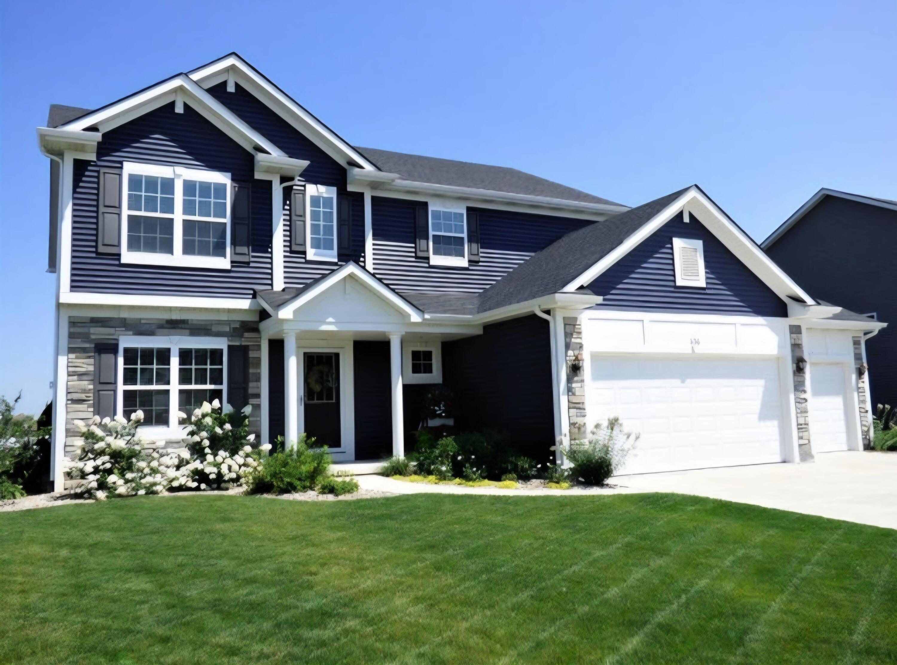 a front view of a house with a yard and porch
