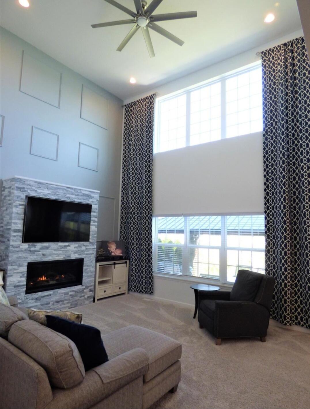 636 East 119th Place Crown Point, IN 46307 - Photo 14 of 35 a living room with furniture a flat screen tv and a fireplace