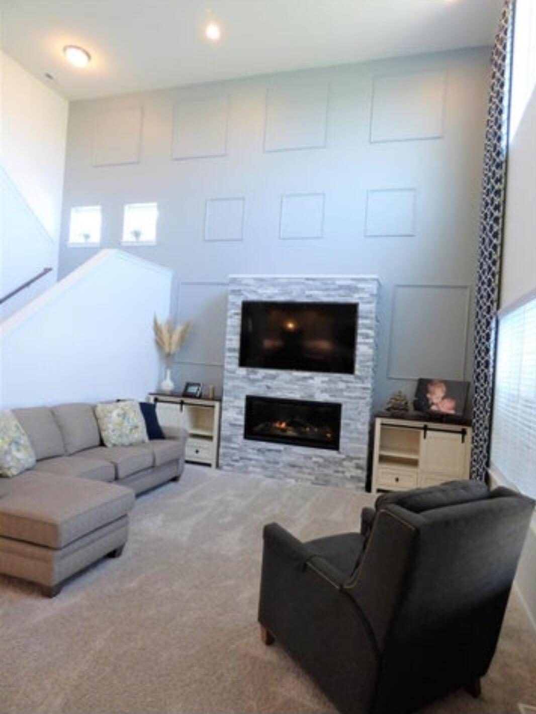 636 East 119th Place Crown Point, IN 46307 - Photo 15 of 35 a living room with furniture a fireplace and a flat screen tv