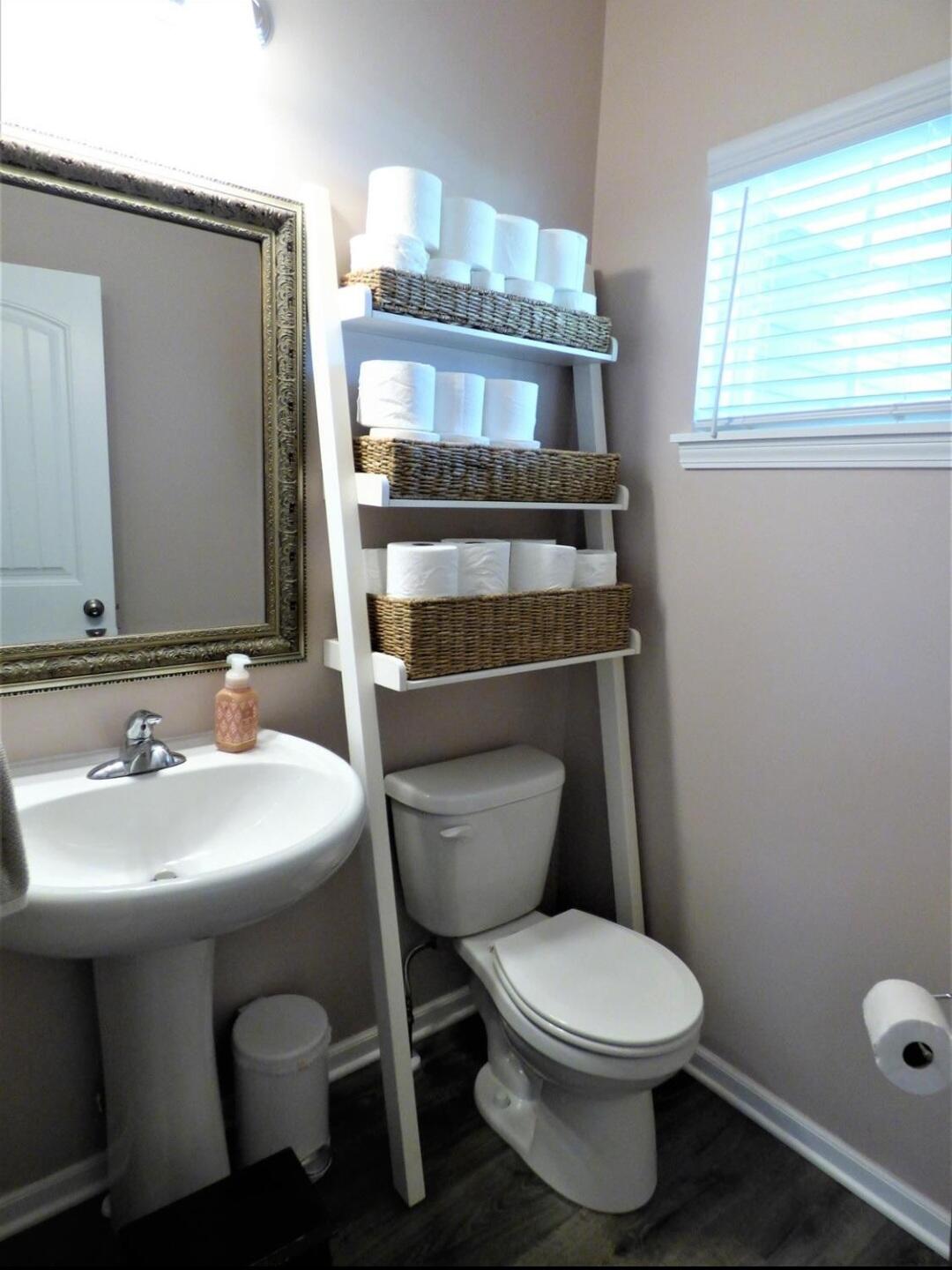 636 East 119th Place Crown Point, IN 46307 - Photo 16 of 35 a bathroom with a toilet a sink and a mirror