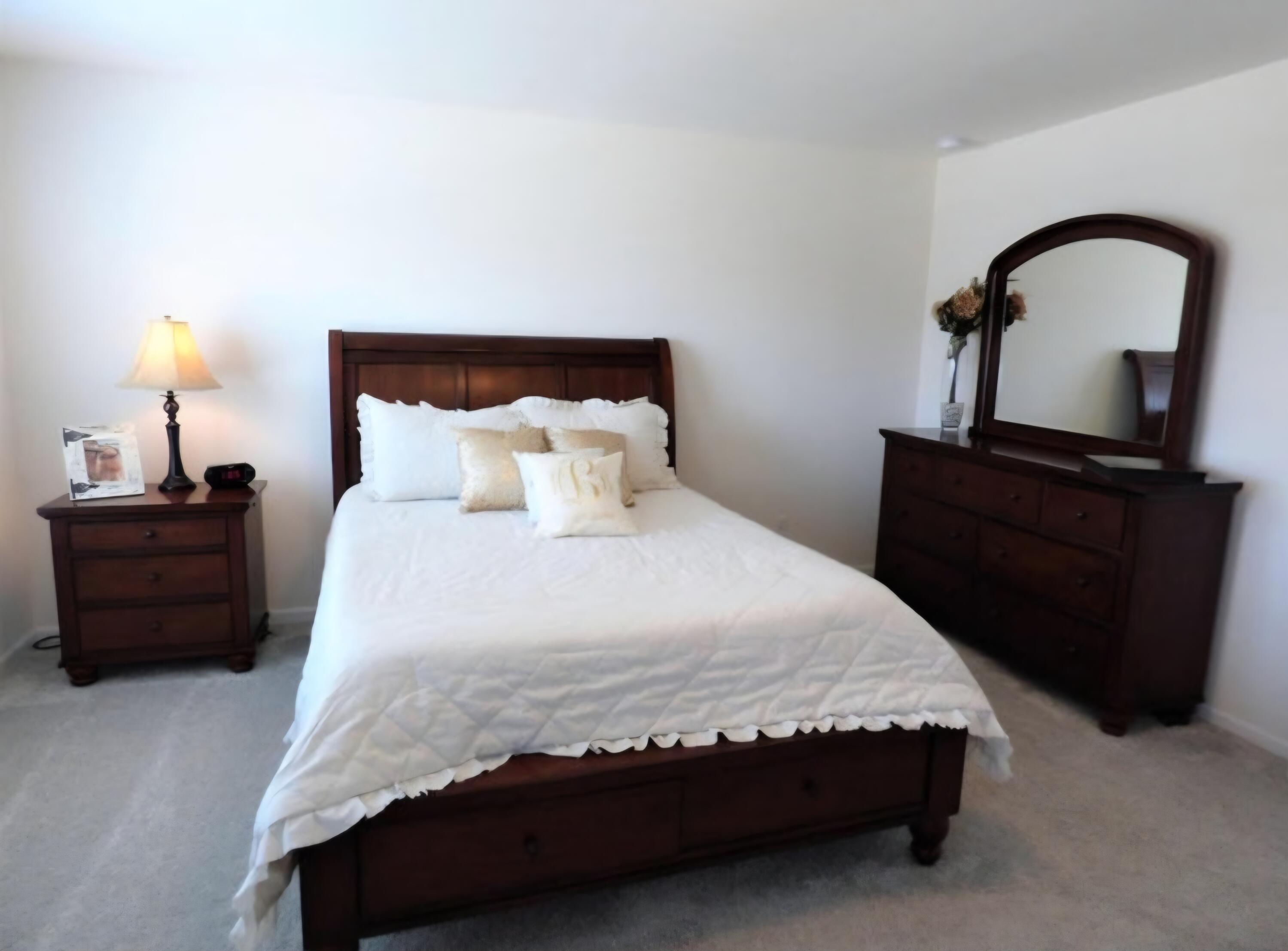636 East 119th Place Crown Point, IN 46307 - Photo 17 of 35 a bedroom with a bed and a dresser