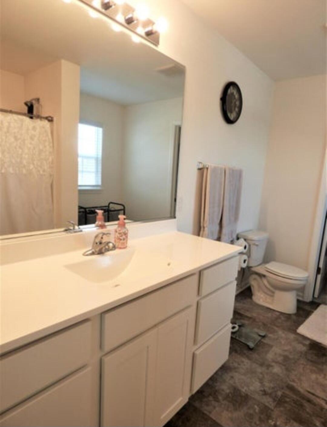 636 East 119th Place Crown Point, IN 46307 - Photo 18 of 35 a bathroom with a sink and a mirror