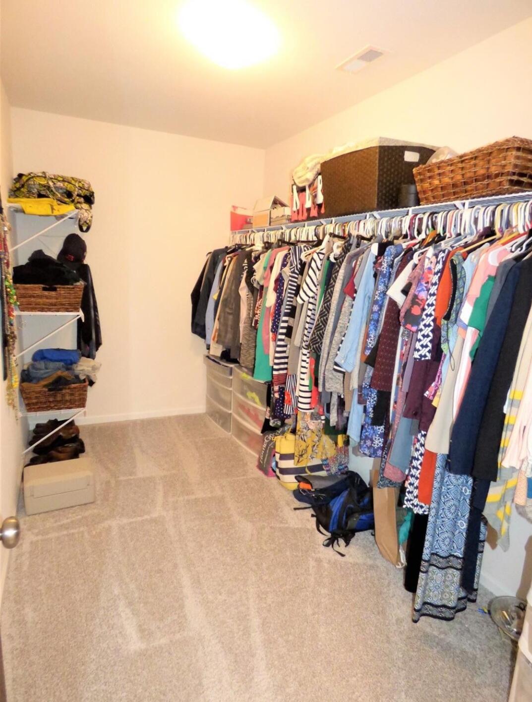 636 East 119th Place Crown Point, IN 46307 - Photo 20 of 35 a view of walk in closet with clothes and shoes