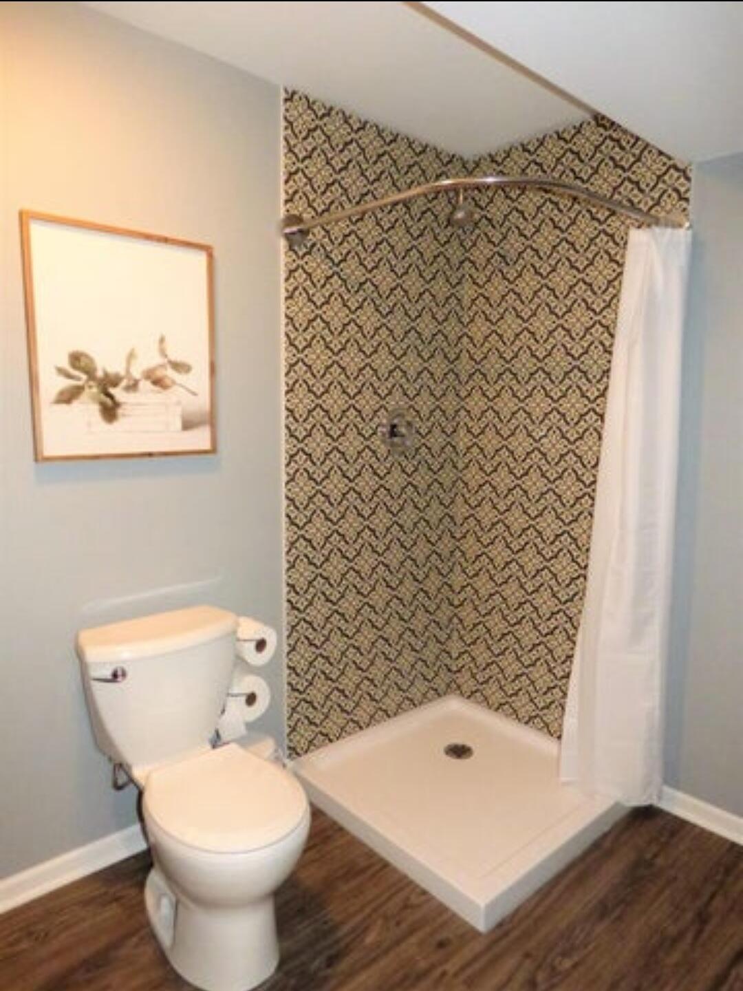 636 East 119th Place Crown Point, IN 46307 - Photo 28 of 35 a bathroom with a toilet and a shower curtain