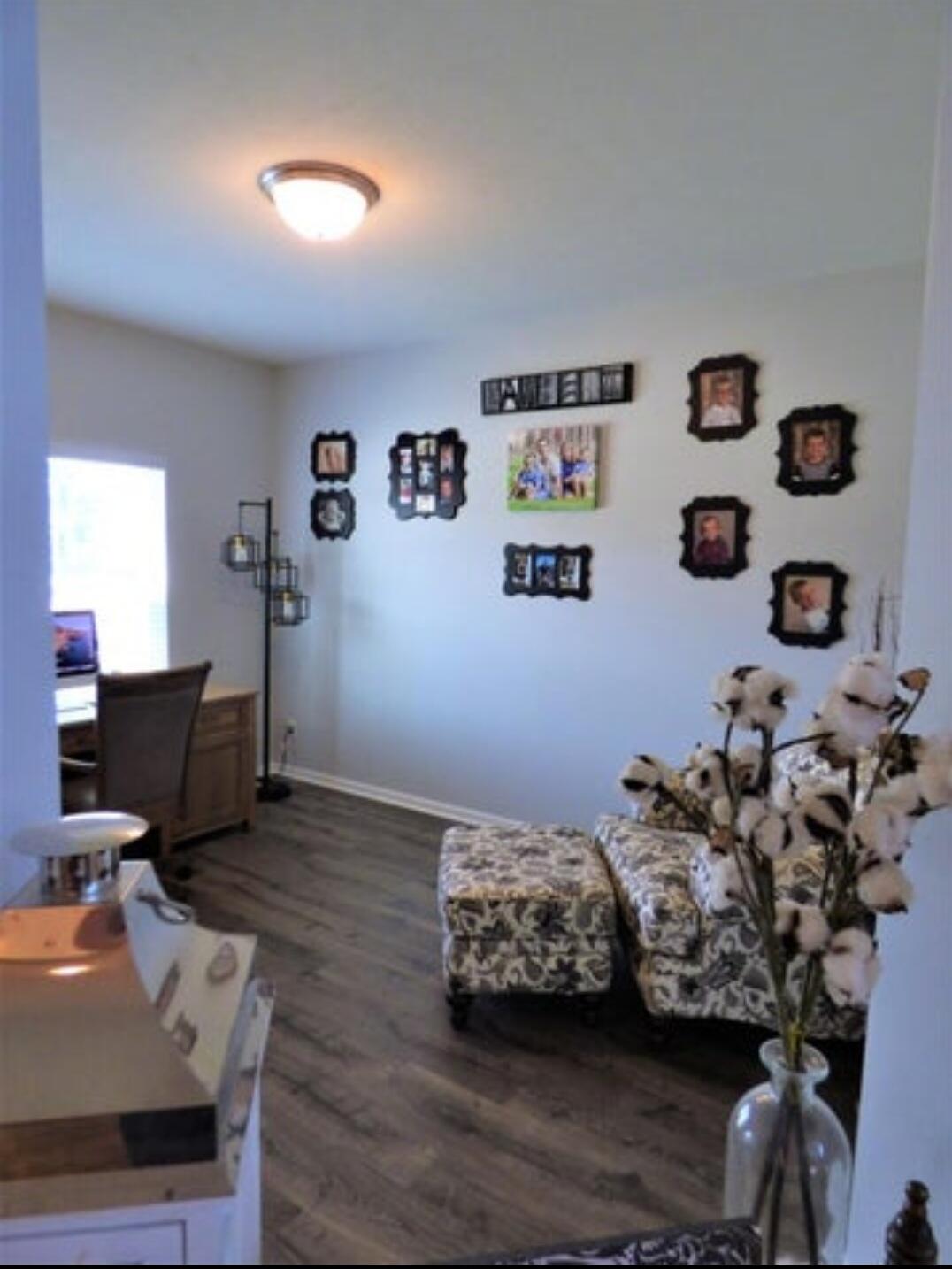 636 East 119th Place Crown Point, IN 46307 - Photo 3 of 35 a bedroom with furniture and a wooden floor