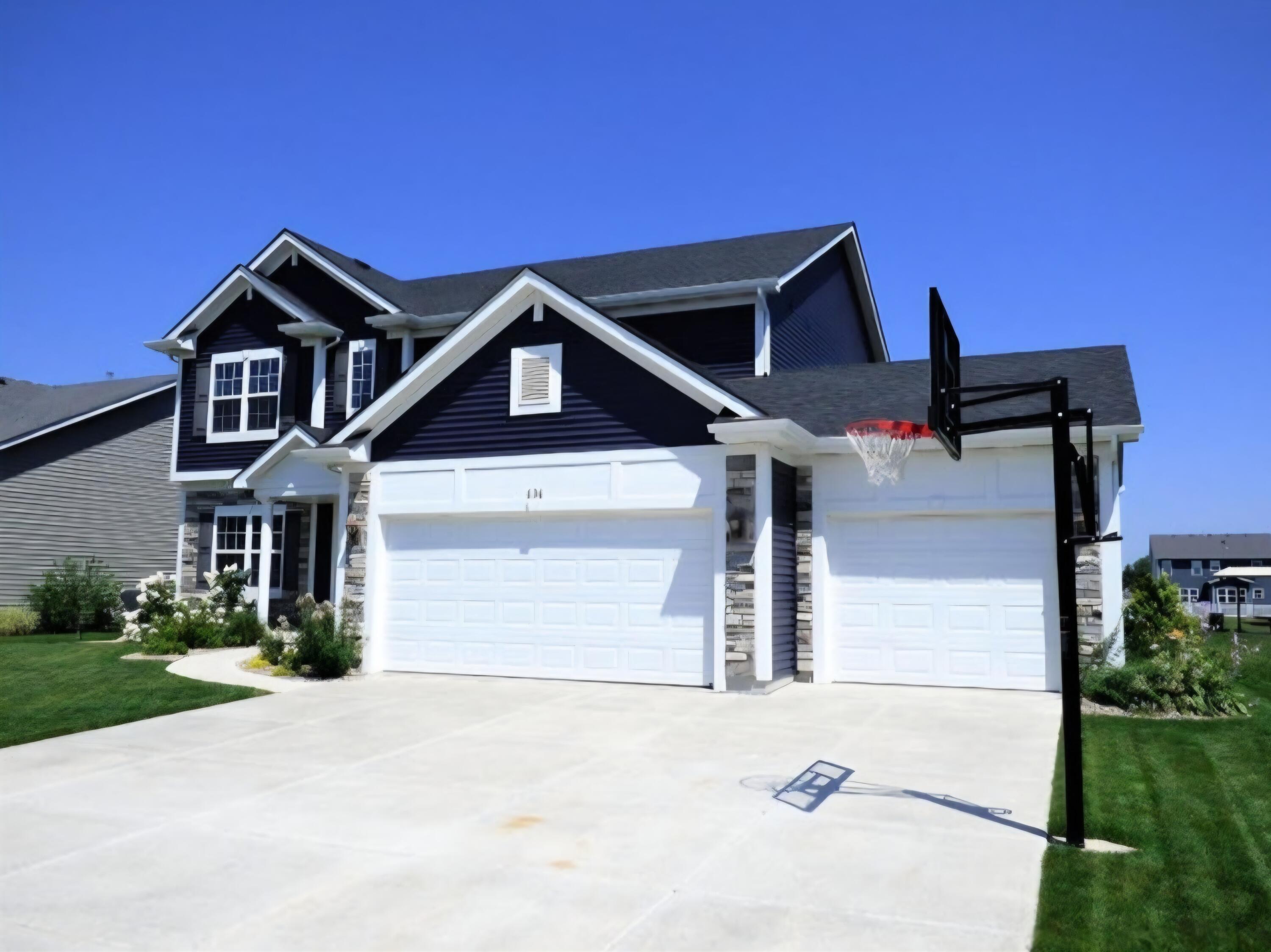 636 East 119th Place Crown Point, IN 46307 - Photo 34 of 35 a front view of a house with a yard and garage
