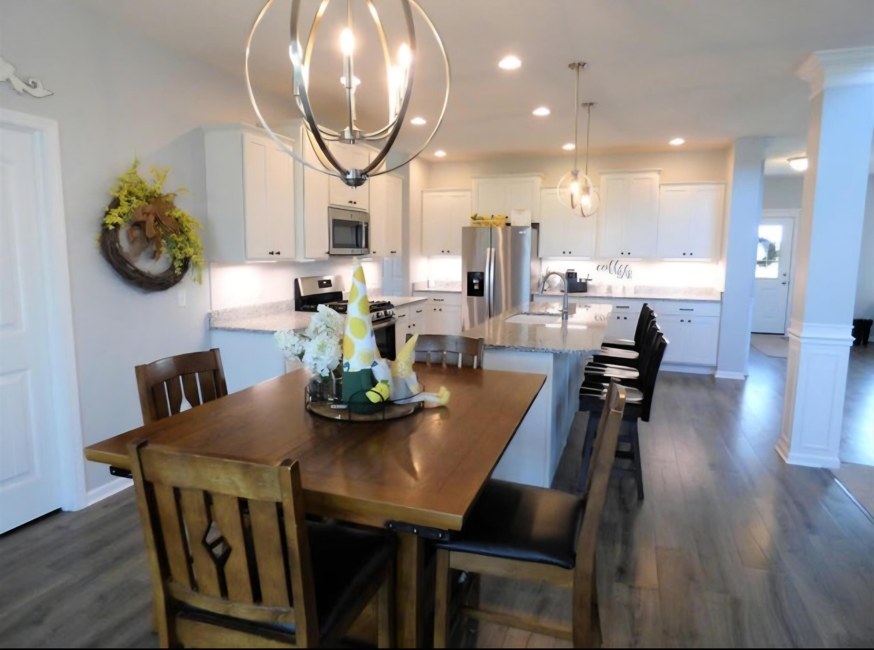 636 East 119th Place Crown Point, IN 46307 - Photo 7 of 35 a view of a dining room with furniture and wooden floor