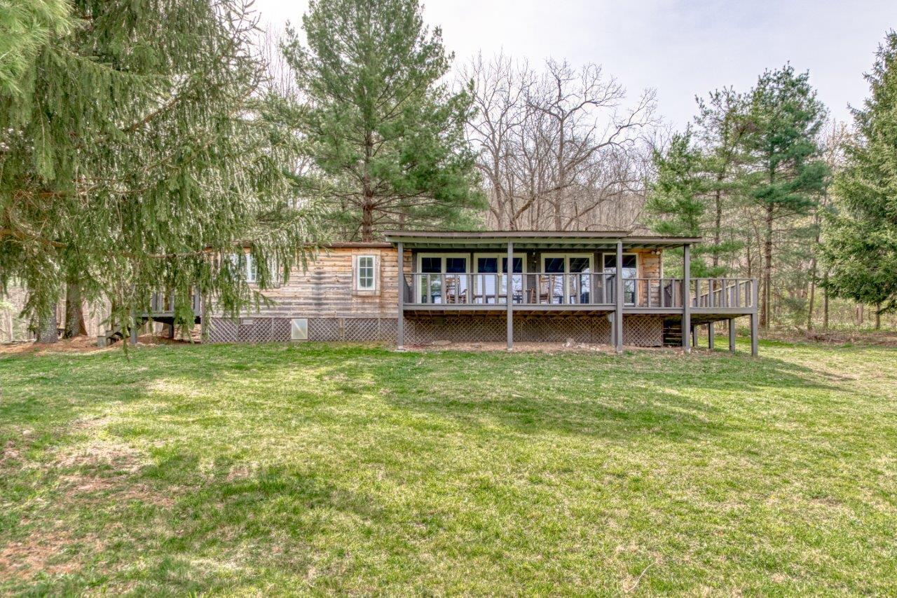 1696 Green Valley Road Peterstown, WV 24963 - Photo 120 of 132 a view of a house with a garden and trees