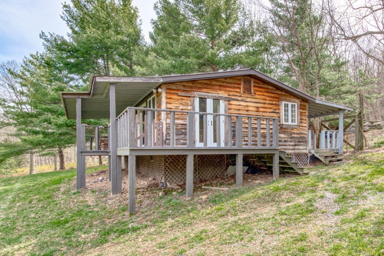 1696 Green Valley Road Peterstown, WV 24963 - Photo 125 of 132 a backyard of a house with wooden deck and barbeque oven