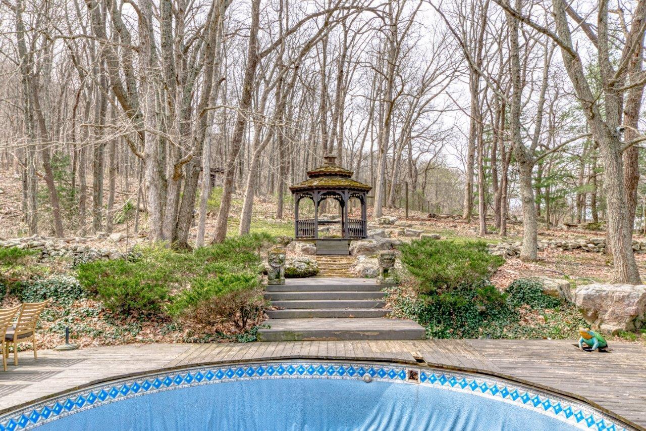 1696 Green Valley Road Peterstown, WV 24963 - Photo 26 of 132 a front view of a house with garden and sitting area