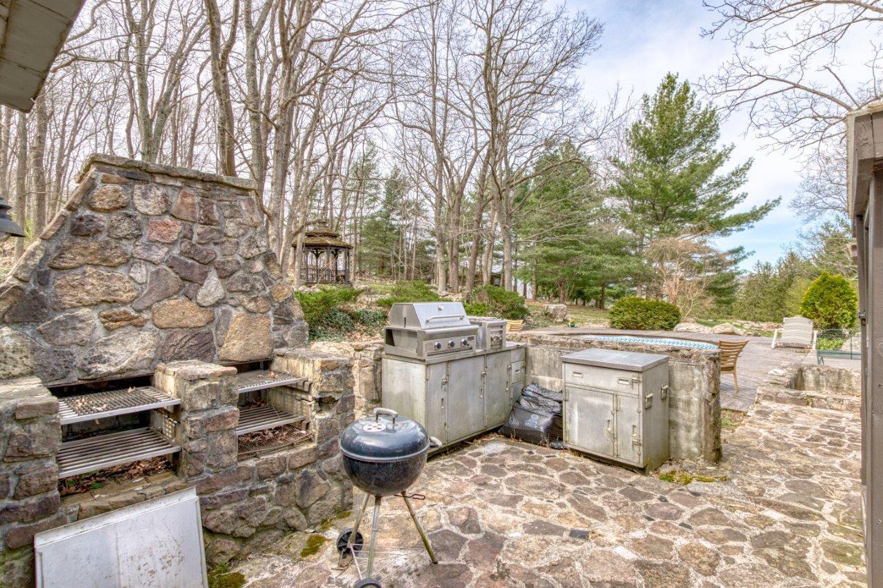 1696 Green Valley Road Peterstown, WV 24963 - Photo 29 of 132 a view of a patio with table and chairs and potted plants