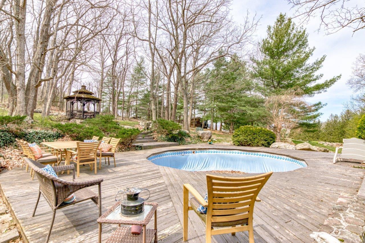 1696 Green Valley Road Peterstown, WV 24963 - Photo 30 of 132 a view of a swimming pool with a lounge chairs