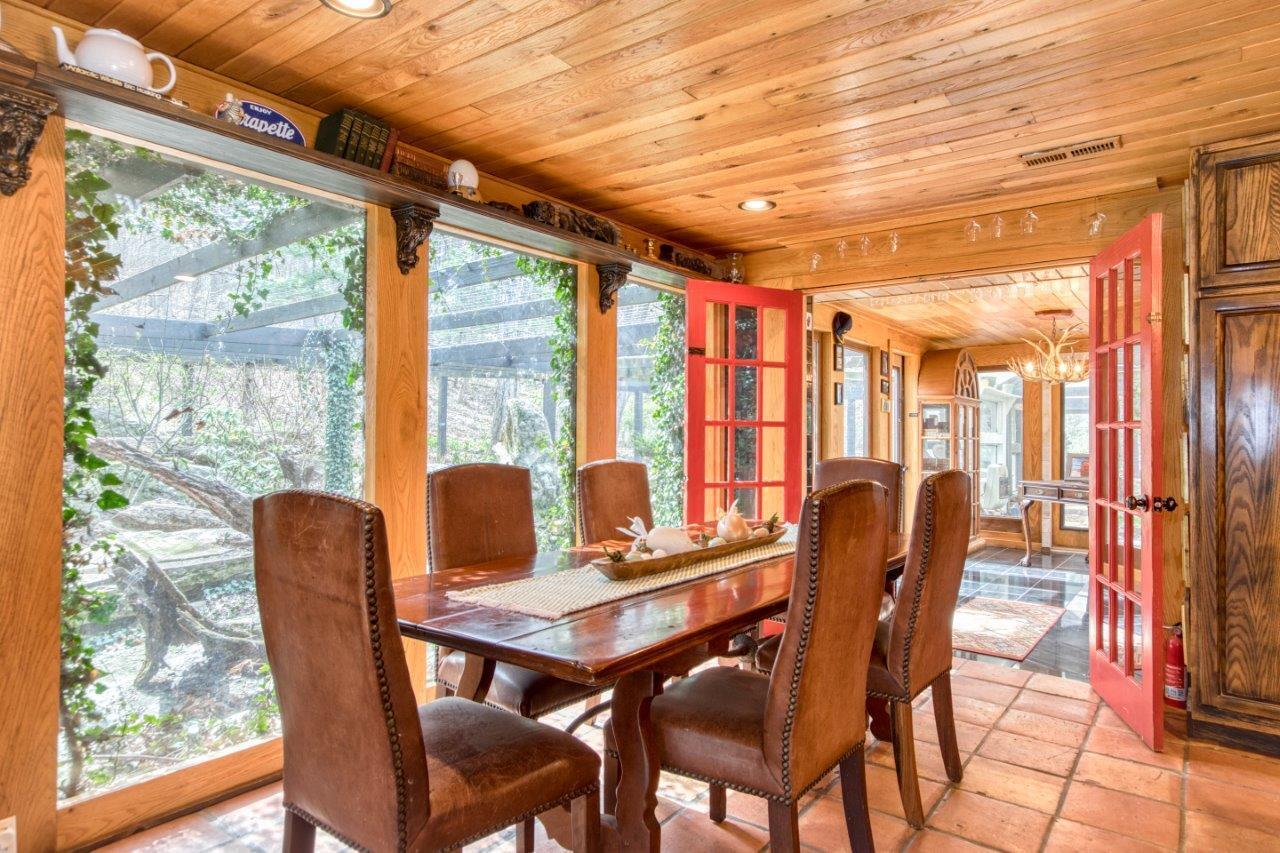 1696 Green Valley Road Peterstown, WV 24963 - Photo 46 of 132 a dining room with furniture a chandelier and wooden floor