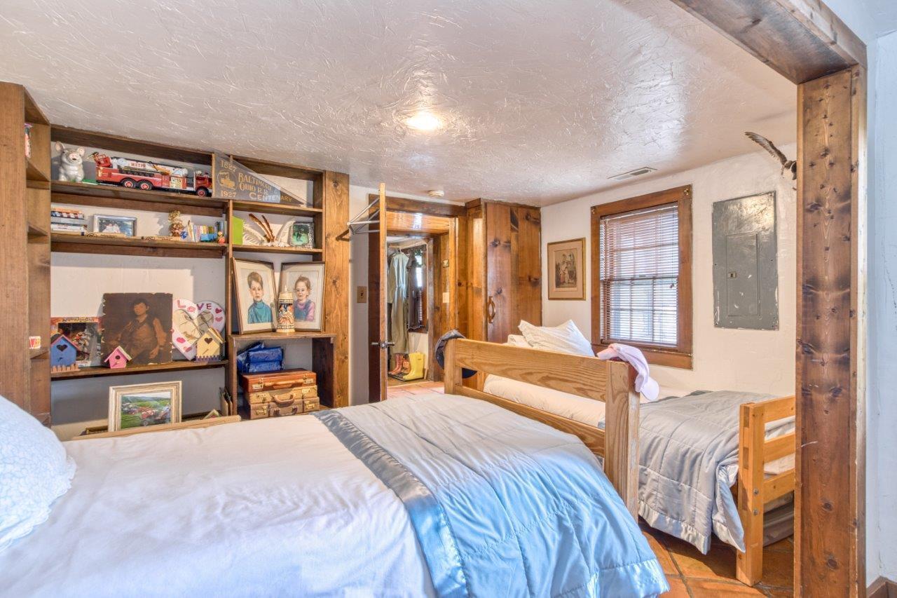 1696 Green Valley Road Peterstown, WV 24963 - Photo 65 of 132 a bedroom with a large bed and a large window