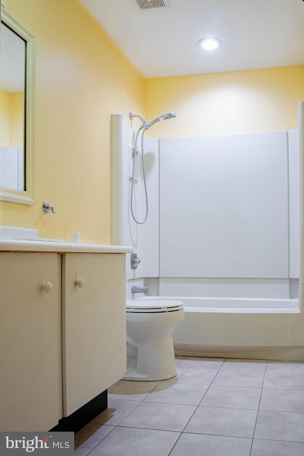 906 Locust Street Philadelphia, PA 19107 - Photo 14 of 46 a bathroom with a bathtub and a shower