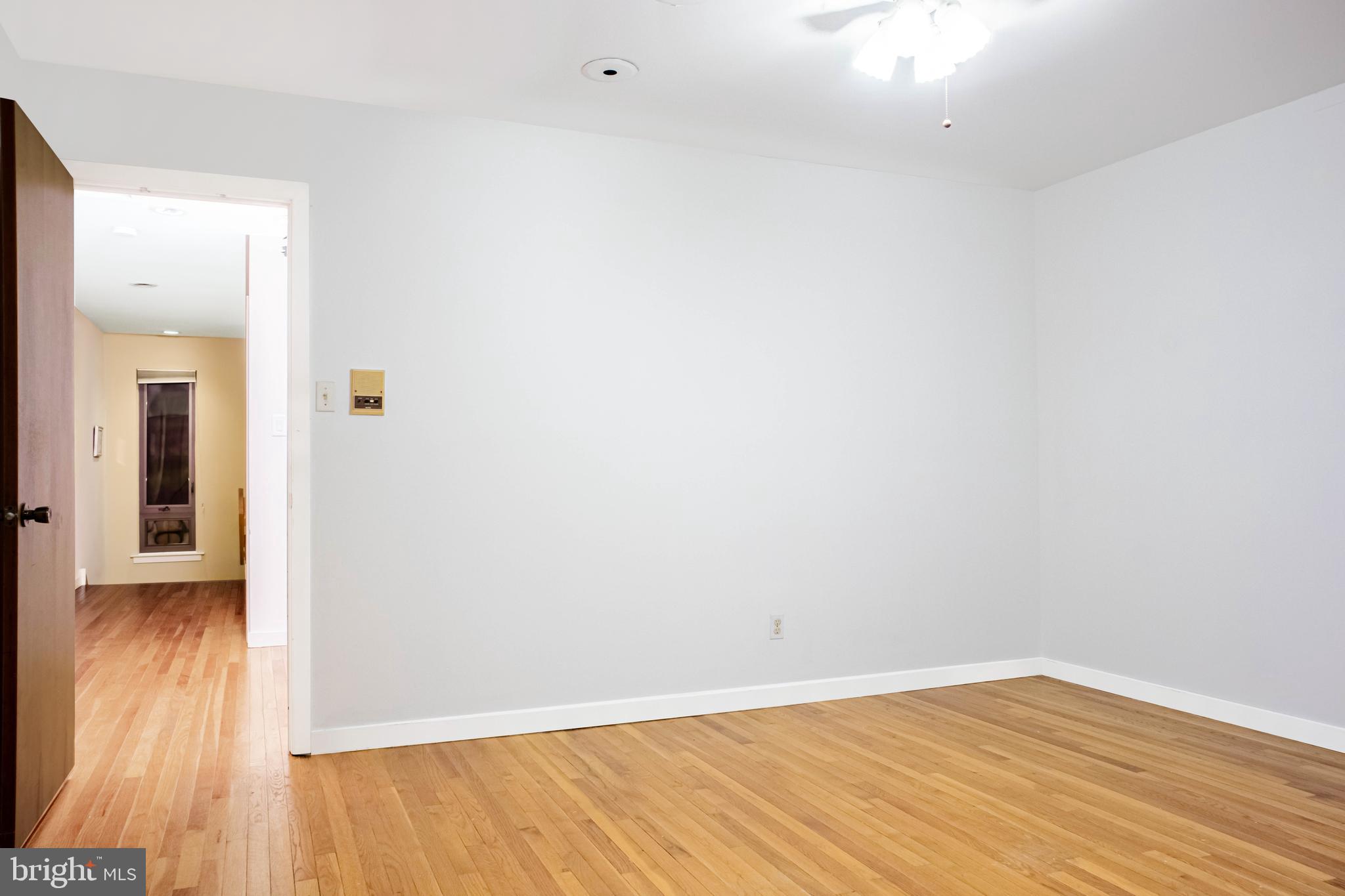 906 Locust Street Philadelphia, PA 19107 - Photo 15 of 46 a view of an empty room with wooden floor