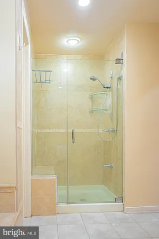 a large bathroom with a double vanity sink and a mirror
