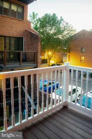 a bedroom with a bed and a view of wall