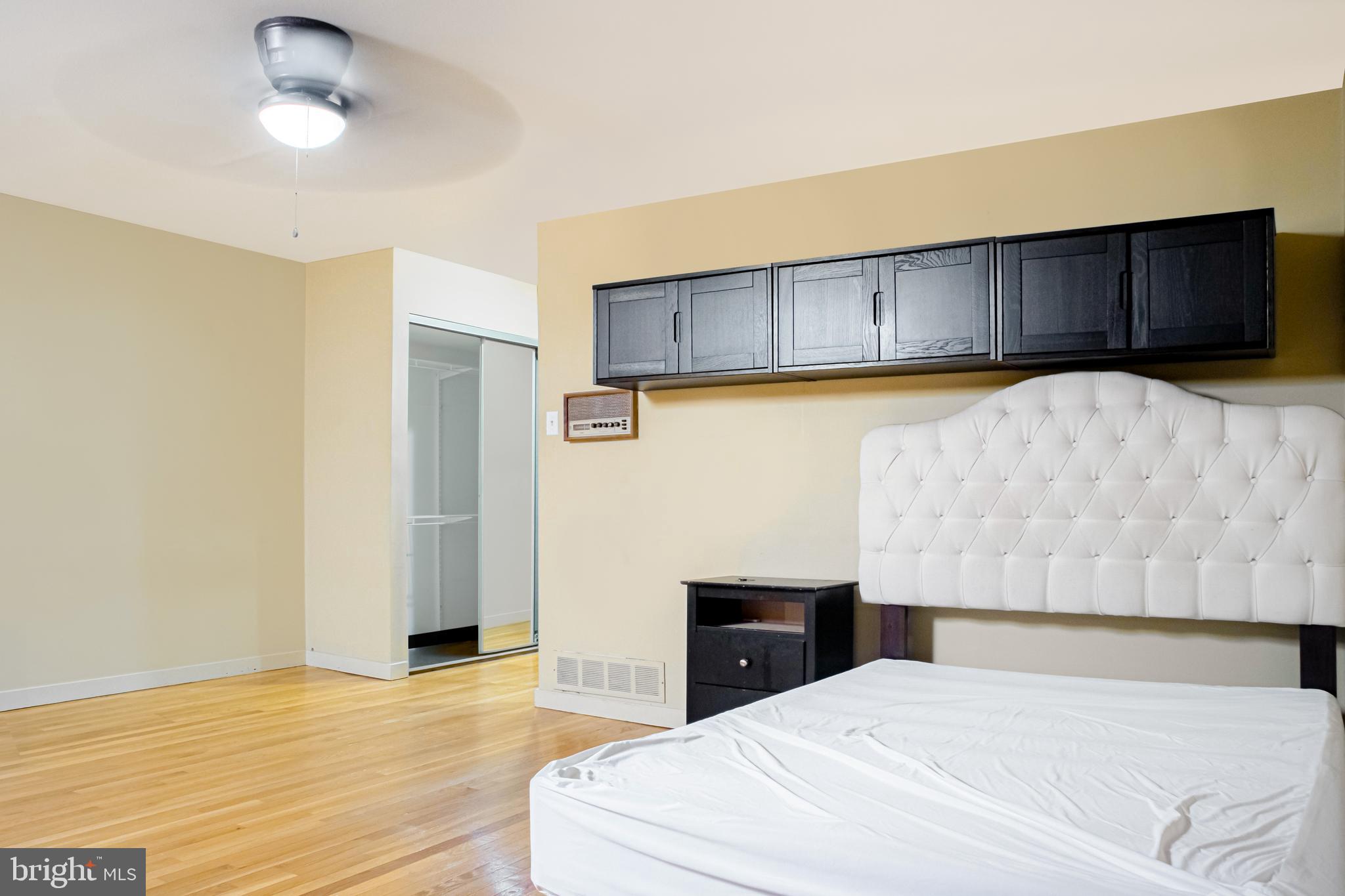 906 Locust Street Philadelphia, PA 19107 - Photo 22 of 46 a bedroom with a bed and a view of wall