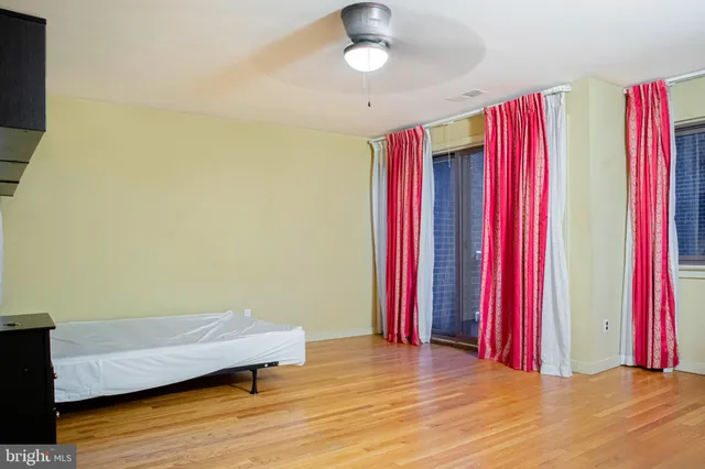 a view of balcony with wooden floor and door