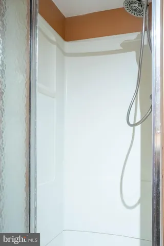 a view of storage and utility room with washer and dryer