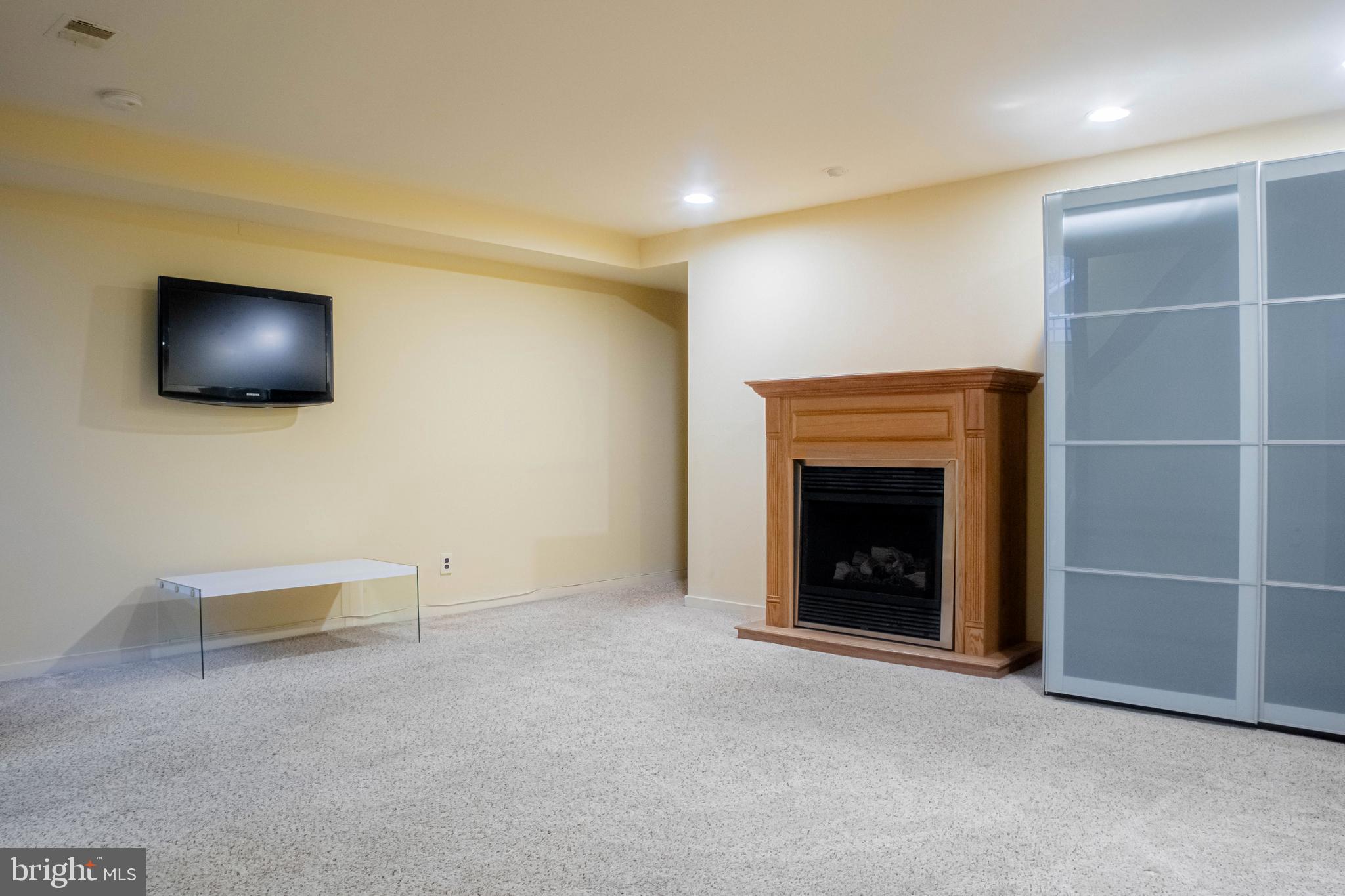 906 Locust Street Philadelphia, PA 19107 - Photo 32 of 46 a view of an empty room with a fireplace