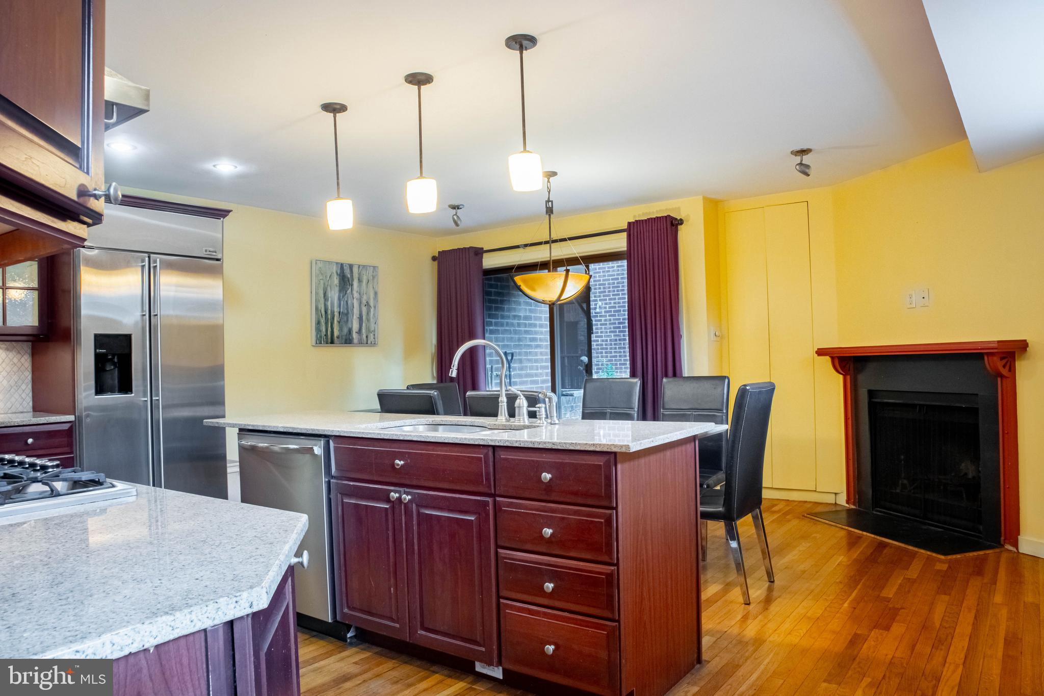 906 Locust Street Philadelphia, PA 19107 - Photo 37 of 46 a kitchen with a stove and a wooden floor
