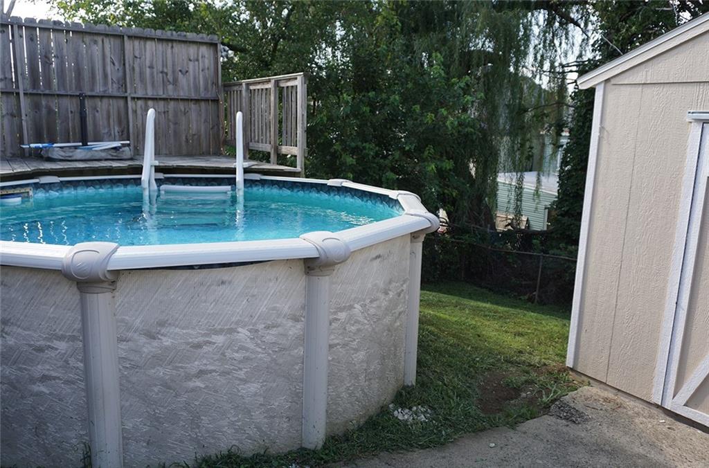 421 Ormsby Avenue Pittsburgh, PA 15210 - Photo 28 of 30 a backyard with table and chairs and wooden fence