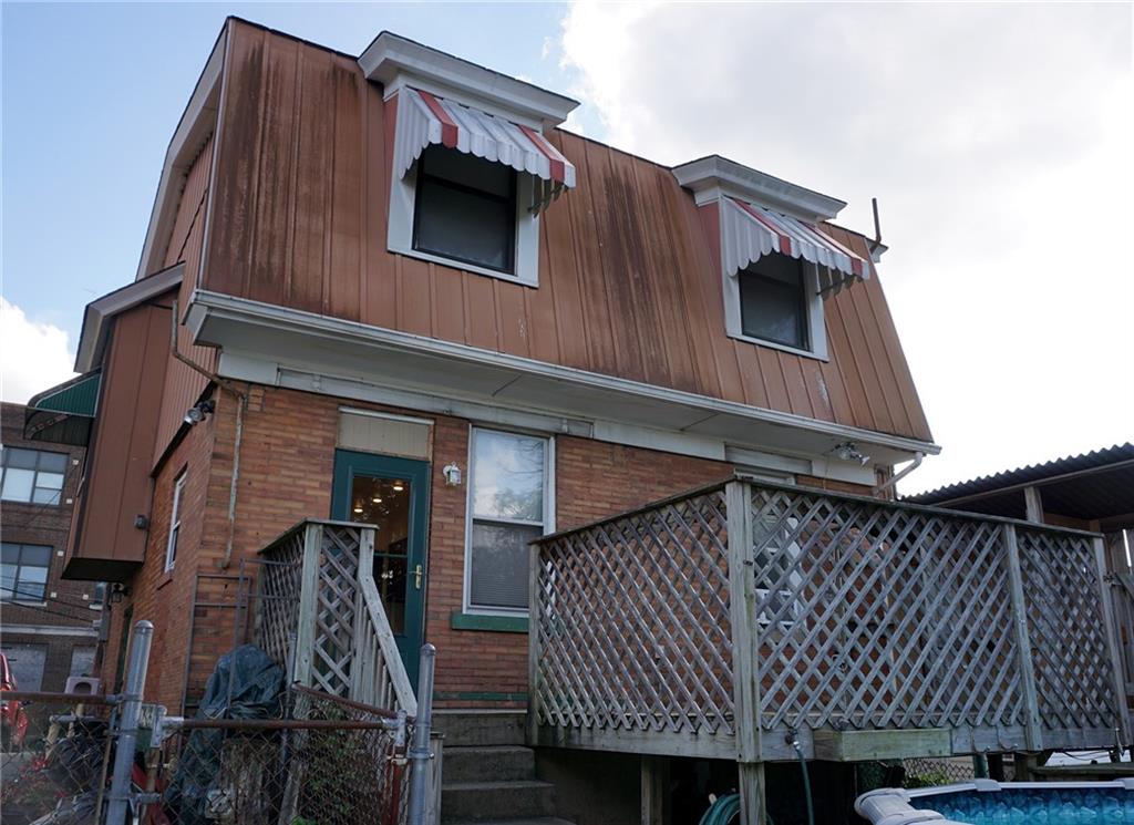 421 Ormsby Avenue Pittsburgh, PA 15210 - Photo 29 of 30 a view of a house with a large window