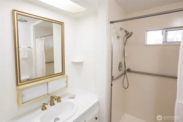 a bathroom with a sink and a mirror
