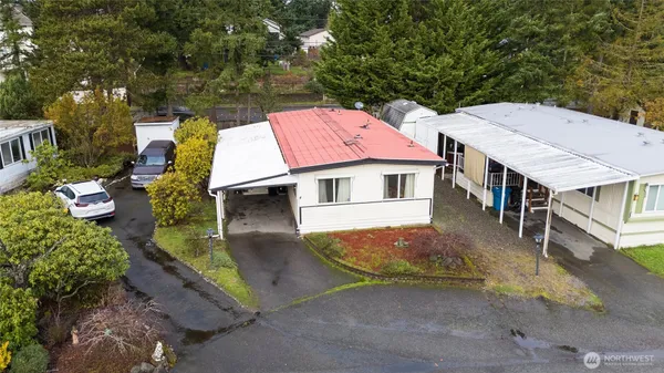 an aerial view of a house with a yard