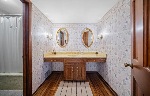 a bathroom with a sink and a mirror