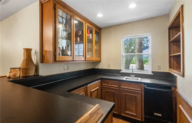 a kitchen with a sink and a window