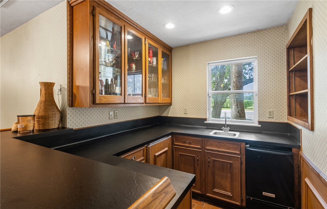 5222 Wooldridge Road Corpus Christi, TX 78413 - Photo 14 of 34 a kitchen with a sink and a window