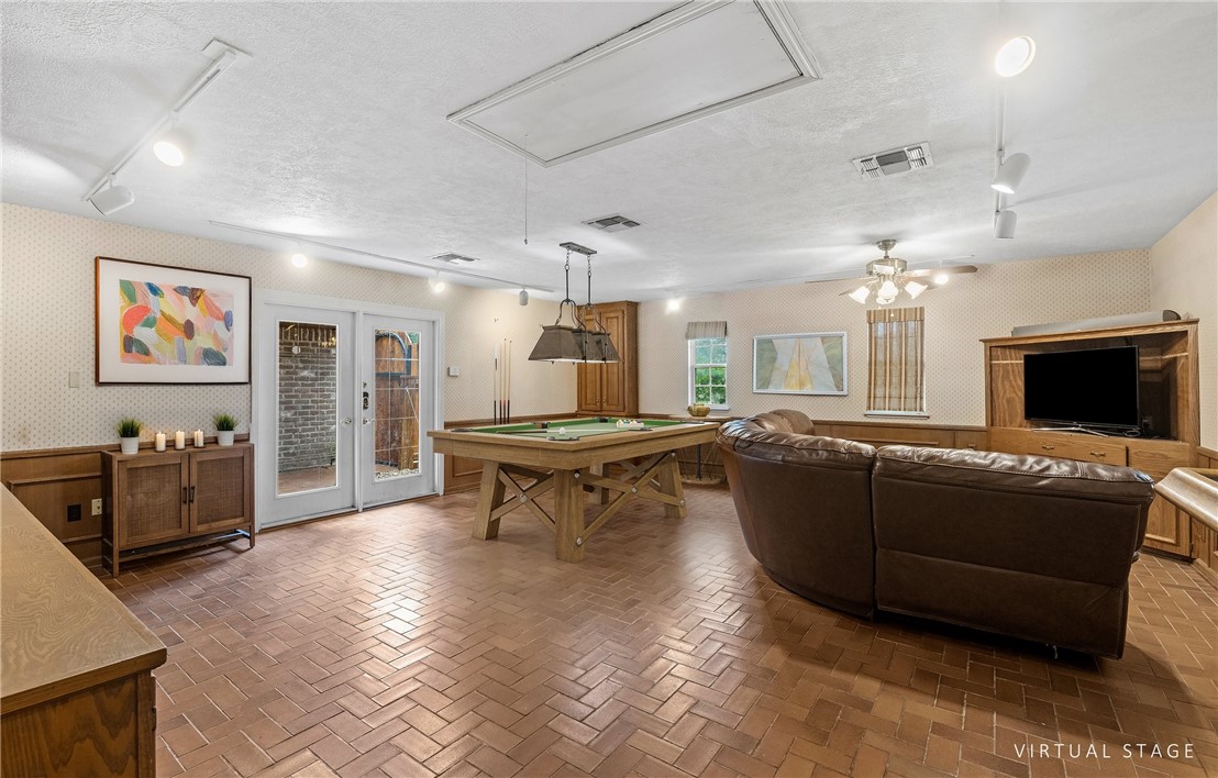 5222 Wooldridge Road Corpus Christi, TX 78413 - Photo 15 of 34 a living room with furniture and a fireplace
