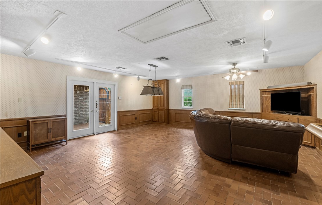 5222 Wooldridge Road Corpus Christi, TX 78413 - Photo 16 of 34 a living room with furniture and a fireplace