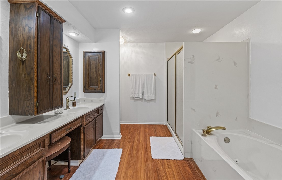 5222 Wooldridge Road Corpus Christi, TX 78413 - Photo 26 of 34 a bathroom with a tub a sink and mirrors