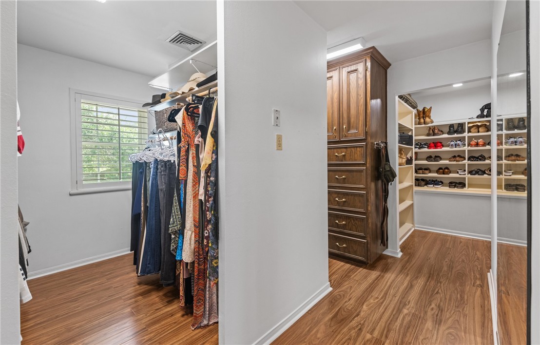 5222 Wooldridge Road Corpus Christi, TX 78413 - Photo 28 of 34 a view of walk in closet with clothes and shoes