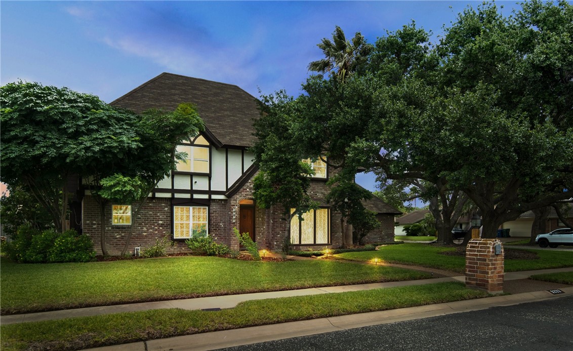 5222 Wooldridge Road Corpus Christi, TX 78413 - Photo 34 of 34 a view of a white house with a big yard and large tree