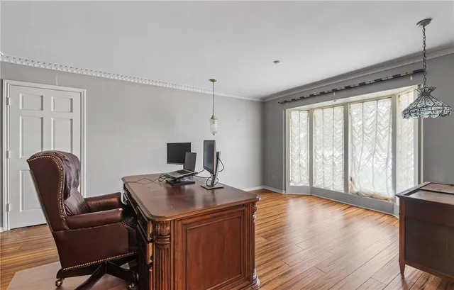 a workspace with furniture and a window