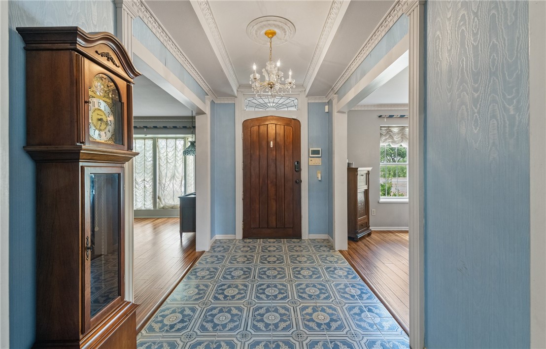 5222 Wooldridge Road Corpus Christi, TX 78413 - Photo 5 of 34 a view of a hallway with wooden floor and a chandelier