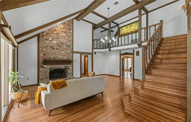a view of a livingroom with fireplace and furniture