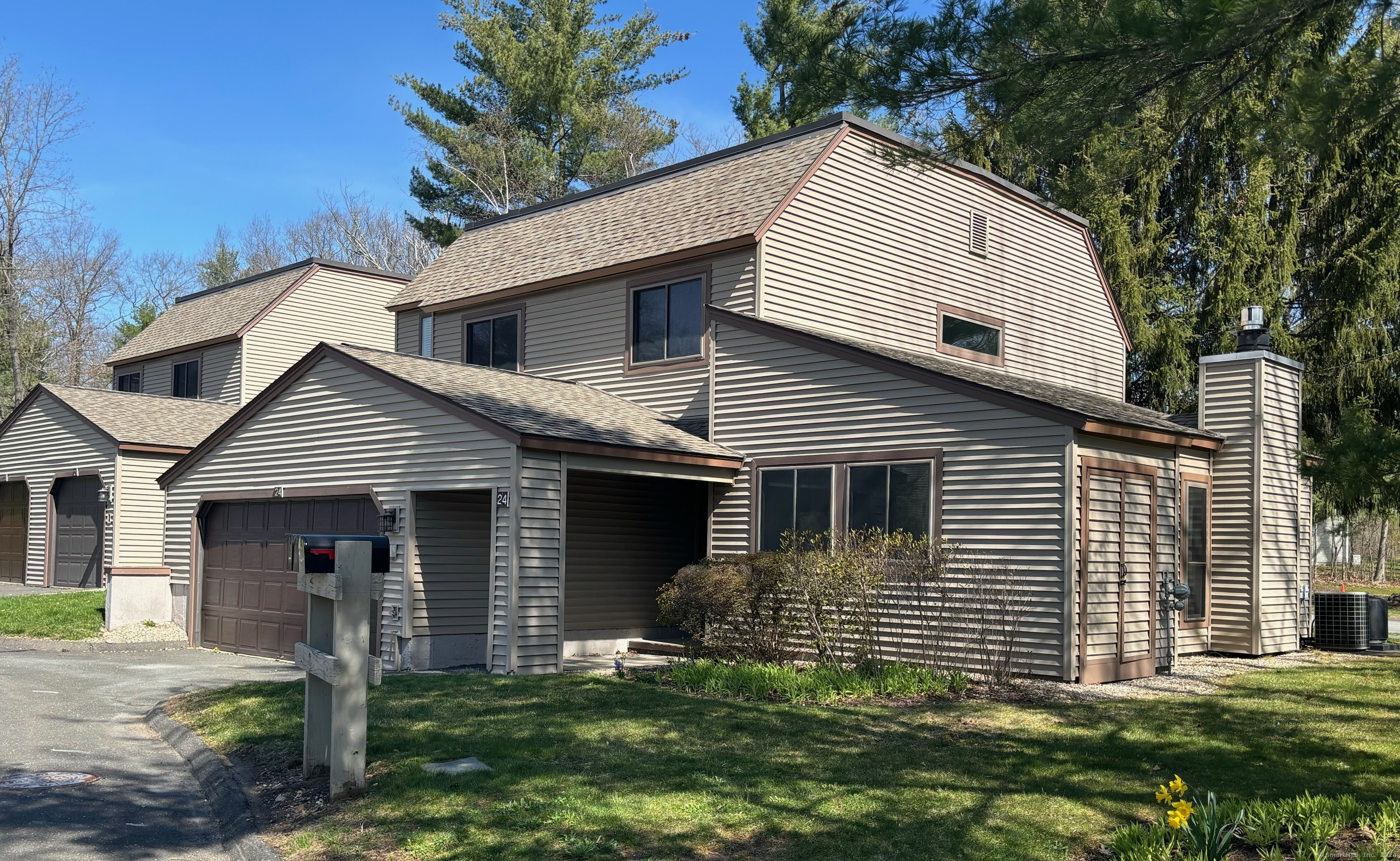 24 Maple Lane, Unit 24 Avon, CT 06001 - Photo 1 of 1 a front view of a house with a garden
