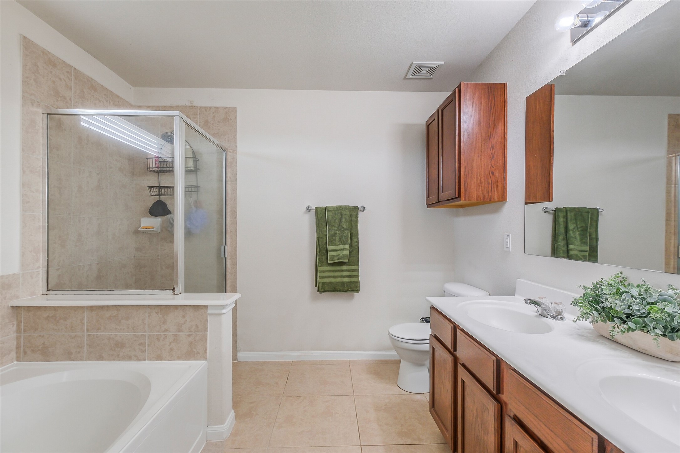 1015 Honeysuckle Vine Drive Rosenberg, TX 77469 - Photo 18 of 29 a bathroom with a sink a toilet and shower
