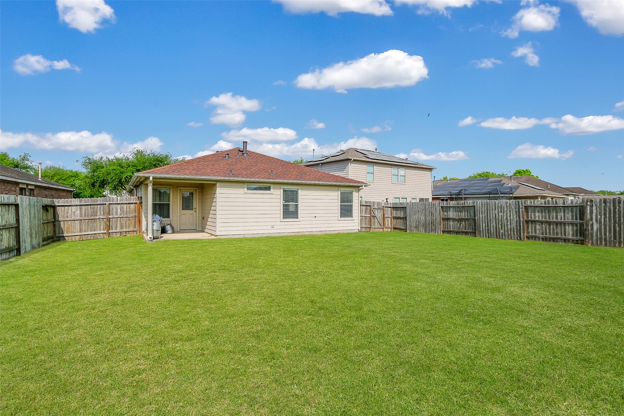 1015 Honeysuckle Vine Drive Rosenberg, TX 77469 - Photo 26 of 29 a view of a house with a backyard