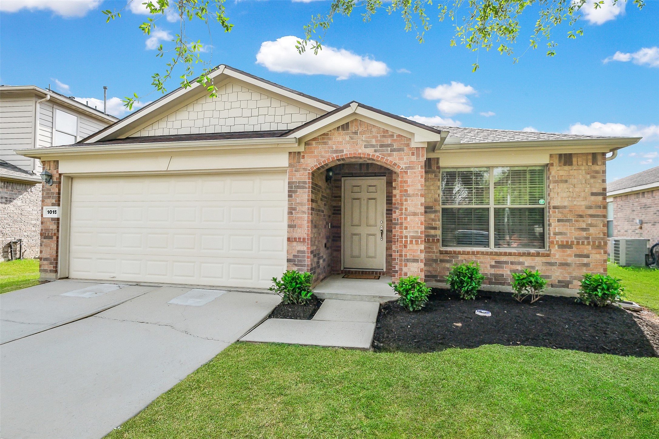 1015 Honeysuckle Vine Drive Rosenberg, TX 77469 - Photo 3 of 29 a front view of a house with a yard and a garage