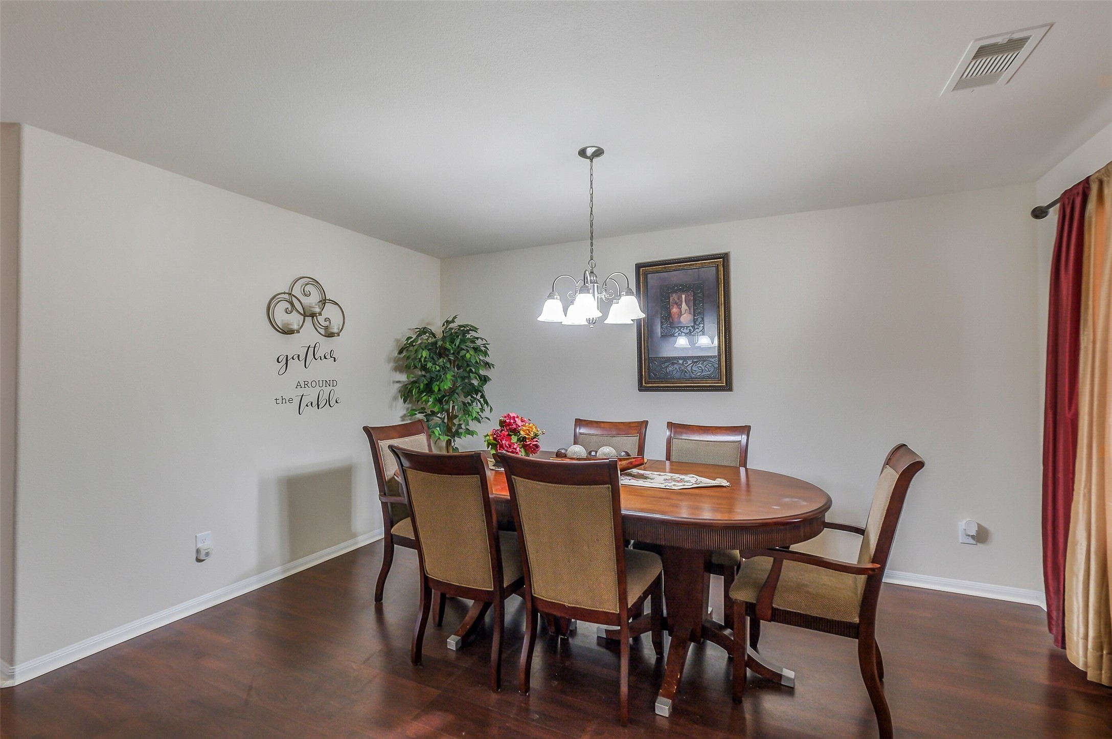 1015 Honeysuckle Vine Drive Rosenberg, TX 77469 - Photo 5 of 29 a view of a dining room with furniture and wooden floor