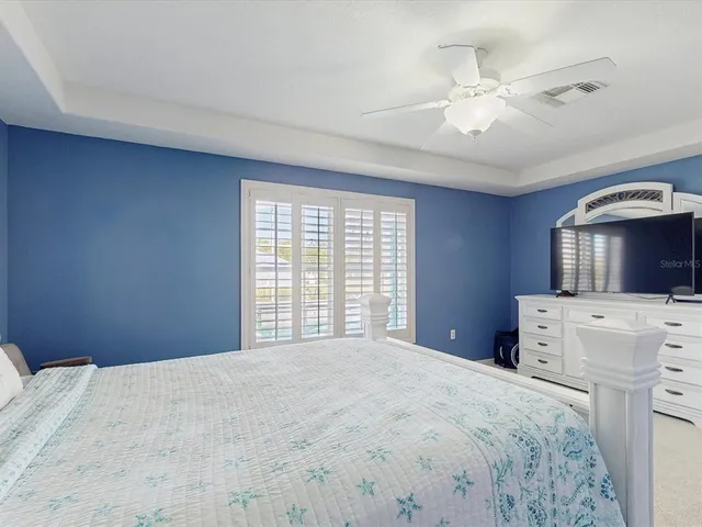 a bathroom with a double vanity sink mirror and shower