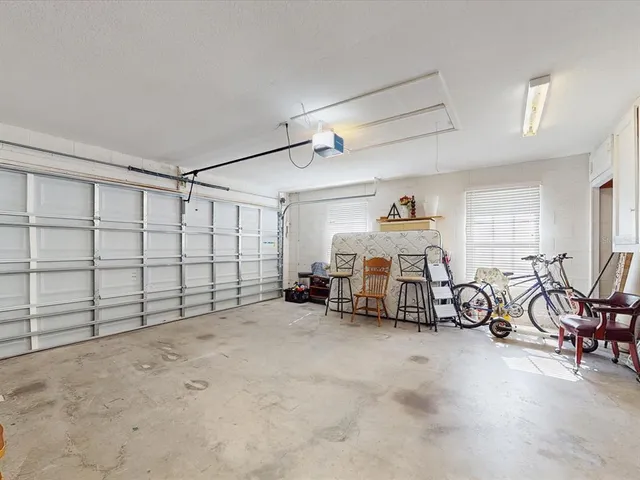 an outdoor space with swimming pool and furniture