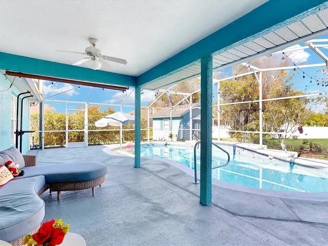 a view of a swimming pool with a patio